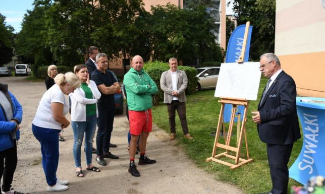 wspólnie porozmawiać o planowanej budowie nowego parkingu